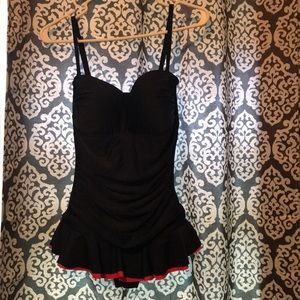 Navy blue one piece bathing suit.